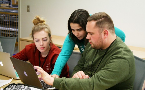 Zachary Person (right) working with fellow students on FYRE project.